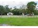 Charming two-story home with a white picket fence, a detached garage and lots of lush trees at 5403 Red Rooster Rd, Parrish, FL 34219
