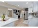 Elegant kitchen with stainless steel appliances, white cabinets, and center island at 5403 Red Rooster Rd, Parrish, FL 34219