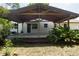 Covered patio area, perfect for outdoor entertaining and relaxation at 5403 Red Rooster Rd, Parrish, FL 34219