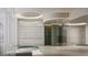 Modern spa featuring a hot tub, walk-in shower, and textured tile, perfect for relaxation and wellness at 555 Quay Cmn # 405, Sarasota, FL 34236