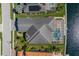 An overhead view of the home featuring a screened-in pool and a beautiful view of the waterway at 569 Mast Dr, Bradenton, FL 34208
