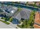 An aerial view of a beautiful home that includes a three-car garage and a screened-in pool at 569 Mast Dr, Bradenton, FL 34208