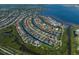 Stunning aerial view of waterfront homes on canals with access to the bay and a lush, green landscape at 569 Mast Dr, Bradenton, FL 34208
