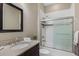 Cozy bathroom featuring a shower-tub combo, vanity, and a wall mounted mirror for an elegant touch at 569 Mast Dr, Bradenton, FL 34208
