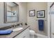 Modern bathroom featuring a shower, marble vanity with a silver framed mirror, and a comfort height toilet at 569 Mast Dr, Bradenton, FL 34208