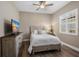 Bedroom featuring hard wood floors, a ceiling fan, and furniture at 569 Mast Dr, Bradenton, FL 34208