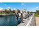 Waterfront property featuring a boat on a lift with access to beautiful canal and homes at 569 Mast Dr, Bradenton, FL 34208