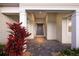 Charming entryway featuring a brick walkway, tasteful landscaping, and a welcoming front door at 569 Mast Dr, Bradenton, FL 34208
