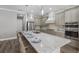 Open-concept kitchen with a large island, perfect for entertaining, featuring modern finishes and countertops at 569 Mast Dr, Bradenton, FL 34208