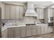 This kitchen features modern appliances, tile backsplash, granite countertops and ample cabinet space at 569 Mast Dr, Bradenton, FL 34208
