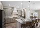 Well-equipped kitchen featuring a spacious island with seating, ample storage, and contemporary finishes at 569 Mast Dr, Bradenton, FL 34208