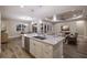 Bright open kitchen features a large island, stainless appliances, and easy access to living area and lanai at 569 Mast Dr, Bradenton, FL 34208