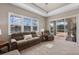 Bright living room featuring plush furniture, recessed lighting, carpet, and a large sliding glass door at 569 Mast Dr, Bradenton, FL 34208