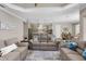 Open-concept living room with hardwood floors and a large doorway leading to the modern kitchen at 569 Mast Dr, Bradenton, FL 34208