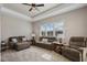 Comfortable living room featuring neutral tones, recessed lighting, plush furniture, and a large window at 569 Mast Dr, Bradenton, FL 34208