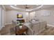 Spacious living room with a ceiling fan and contemporary decor at 569 Mast Dr, Bradenton, FL 34208