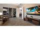 Open living area features lanai access, view of dining room, and a large flat screen television at 569 Mast Dr, Bradenton, FL 34208