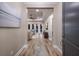 Inviting foyer with hardwood flooring leading into a well-lit living room with tray ceilings and modern decor at 569 Mast Dr, Bradenton, FL 34208