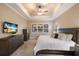 Spacious main bedroom features a trey ceiling, ceiling fan, and light blocking shutters at 569 Mast Dr, Bradenton, FL 34208