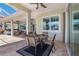 Under-cover outdoor dining with pavers, an outdoor dining table, an outdoor kitchen and lots of light at 569 Mast Dr, Bradenton, FL 34208