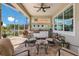 Outdoor living with pavers, a built in grill, seating with a coffee table for enjoying the fresh air at 569 Mast Dr, Bradenton, FL 34208