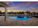 Screened in pool with brick pavers is perfect for cooling off after a long day at 569 Mast Dr, Bradenton, FL 34208