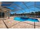 Inviting screened-in pool and patio area, offering the perfect space for relaxation and outdoor enjoyment at 569 Mast Dr, Bradenton, FL 34208