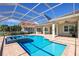 Stunning outdoor pool and spa area is enclosed for year-round enjoyment and privacy at 569 Mast Dr, Bradenton, FL 34208