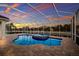 Screened-in pool area with a spa, ideal for year-round enjoyment at 569 Mast Dr, Bradenton, FL 34208
