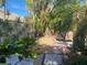 Secluded backyard featuring lush landscaping, a stone path, and patio seating at 5712 34Th W Ct, Bradenton, FL 34210