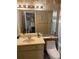 Bathroom featuring a neutral vanity, seaside decor, and blue and white shower curtain at 5712 34Th W Ct, Bradenton, FL 34210