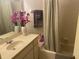 Well-lit bathroom features neutral tile, an updated vanity, and a shower-tub combination at 5712 34Th W Ct, Bradenton, FL 34210