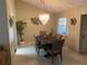Elegant dining room with a modern chandelier, tile floors, and seating for six, perfect for entertaining at 5712 34Th W Ct, Bradenton, FL 34210