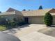 Charming single-story home with a two-car garage, well-maintained landscaping, and a unique tiled roof at 5712 34Th W Ct, Bradenton, FL 34210