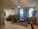 Spacious living room featuring vaulted ceilings, neutral tones, large windows, and comfortable seating arrangement at 5712 34Th W Ct, Bradenton, FL 34210