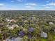 Sprawling community aerial view featuring tree-lined streets and diverse housing options with city views at 5716 Bayshore Blvd, Tampa, FL 33611