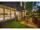 Cozy outdoor seating area with turf, wood tile patio, and an inviting backyard space at 5716 Bayshore Blvd, Tampa, FL 33611