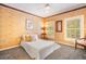 Cozy bedroom with patterned wallpaper, natural light, and a comfortable bed at 5716 Bayshore Blvd, Tampa, FL 33611