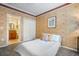 Comfortable bedroom showing a closet and an en-suite bathroom at 5716 Bayshore Blvd, Tampa, FL 33611