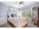 Comfortable bedroom with natural light, a ceiling fan and classic furnishings at 5716 Bayshore Blvd, Tampa, FL 33611