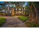 Beautiful two-story home with a lush front yard and mature landscaping, creating a welcoming curb appeal at 5716 Bayshore Blvd, Tampa, FL 33611