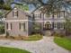 Charming two-story home with a neatly landscaped front yard and a brick-paved walkway at 5716 Bayshore Blvd, Tampa, FL 33611