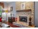 Living room with a stone fireplace, hardwood floors, and elegant decor at 5716 Bayshore Blvd, Tampa, FL 33611