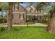 Beautiful home featuring a manicured front lawn, traditional design, and a welcoming entrance at 5716 Bayshore Blvd, Tampa, FL 33611