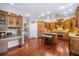 Spacious kitchen with custom cabinets, granite countertops, hardwood floors and island with breakfast bar at 5716 Bayshore Blvd, Tampa, FL 33611