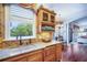 Gourmet kitchen with custom cabinets, granite countertops, stainless steel sink, and breakfast nook at 5716 Bayshore Blvd, Tampa, FL 33611