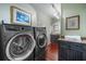 Spacious laundry room with modern washer and dryer units and counter space at 5716 Bayshore Blvd, Tampa, FL 33611