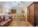 Inviting living room featuring arm chairs, hardwood floors, and a warm ambiance at 5716 Bayshore Blvd, Tampa, FL 33611