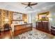 Main bedroom featuring hardwood floors, tray ceilings, and elegant furnishings at 5716 Bayshore Blvd, Tampa, FL 33611