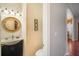 Stylish powder room with unique wallpaper, custom vanity, and modern lighting fixtures at 5716 Bayshore Blvd, Tampa, FL 33611